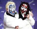 Shaggy 2 Dope and Violent J sharing a friendly hug.