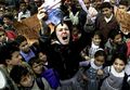 Rachel Corrie at a rally in southern Gaza, burning a self-made US-Israeli flag, you you can give it a try too, just to troll israelis