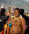 Mswati III of Swaziland Full title: His Majesty King Mswati III, Ingwenyama of Swaziland and Grand Master of the Royal Order of the Great She-Elephant •Seized power in a military coup: Sort of. Succeeded his father as absolute monarch (and commander in chief of the army) in 1986... at the age of 14 •Notable for: being in control of everything, as in having the power to fill any government position (including that of Prime Minister) by clicking his fingers; having the power to dissolve parliament, cancel elections, and veto laws; currently having 15 wives (one of whom he kidnapped and forcibly married while she was still in school); holding annual beauty competitions of 10,000 contestants in order to choose his next wife; arbitrarily kidnapping, jailing, torturing and murdering people who annoy him; trying to force parliament to pass a law compelling the branding and sterilization of women with HIV; eating up $60m every year in "running costs" for his ever-expanding family (while the average citizen earns $1.25 a day); and absent-mindedly pissing away 10% of Swaziland's entire GDP by building an international airport in the middle of fucking nowhere that has never been used because he lost interest halfway through