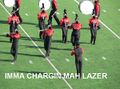 A marching band charges their LAZAR for the judges.