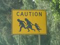 A road sign in San Diego, California warns of Mexicans crossing.